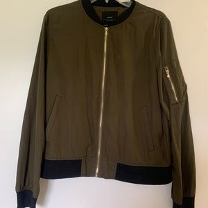 Cool bomber jacket with gold hardware!